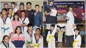 Kareena Kapoor and Saif watch Taimur’s game while Shah Rukh Khan gives his son AbRam a kiss as he wins a Taekwondo competition