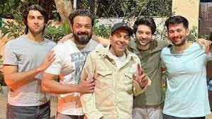 Dharmendra beams broadly as he observes Lohri with Bobby Deol, his son, and his grandchildren Karan, Rajveer, and Aryaman