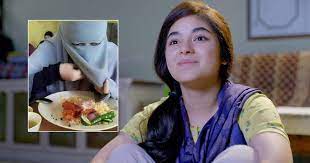When shown a photo of a lady eating while wearing a niqab, Zaira Wasim responds as follows: I made the decision to eat this way specifically