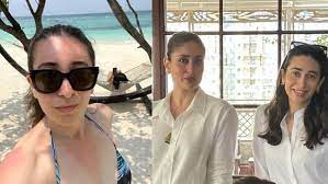 Karisma Kapoor’s retro beach photo, which depicts her’scrolling’ her phone while on vacation, drew a response from Kareena Kapoor
