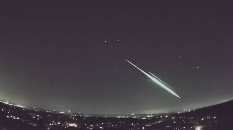 In the US, a green meteor streaks across the night sky