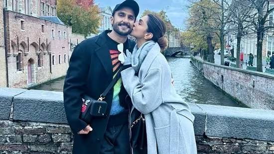 On their fifth anniversary, Deepika Padukone offers Ranveer Singh a passionate kiss, and he can’t help but smile.